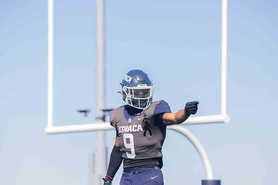 Sophomore wide receiver Nicholas Lang points toward the sideline during an offensive drive for the Bombers.