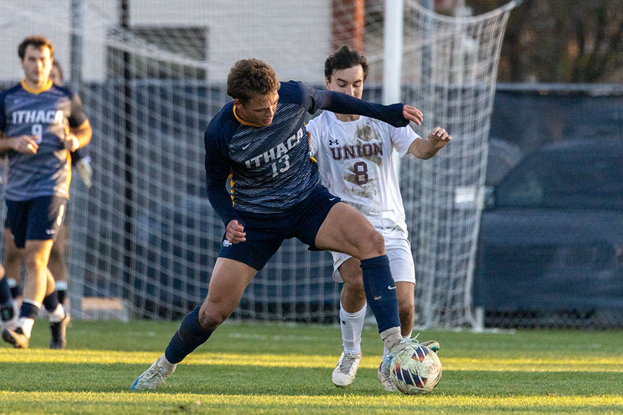 Junior defender Jack Walker tries to win the ball against junior midfielder Grant Della Rocca
