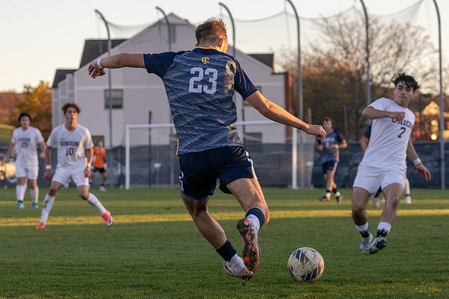 Junior defender Myles Ryan clears the ball