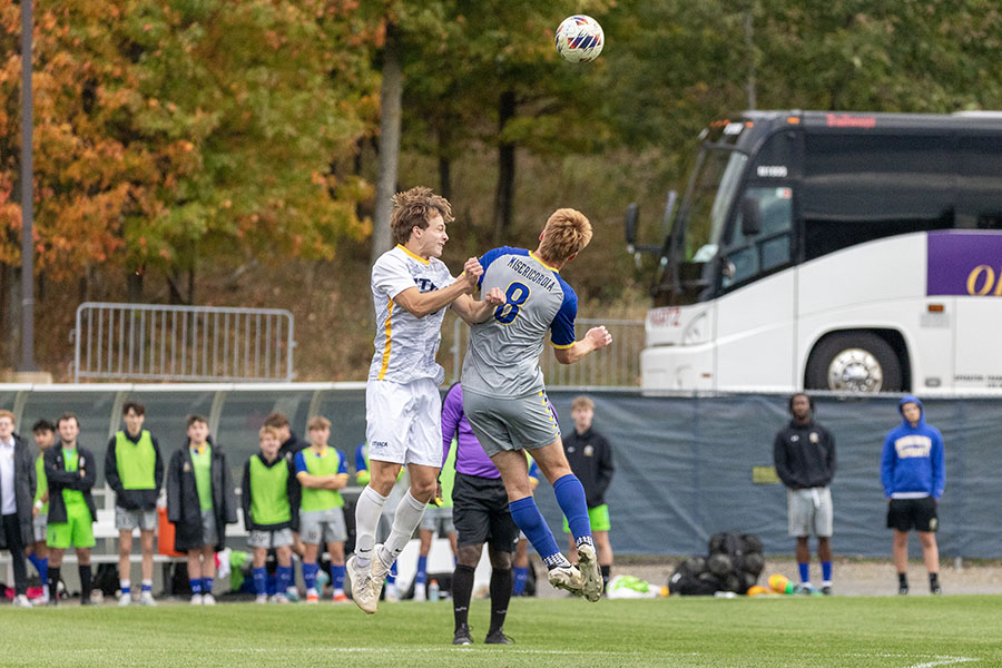 Bombers' junior midfielder Drew Warren competes for a header against junior forward Griffin Weidner during the Ithaca's tie with Misericordia University on Oct. 9. The South Hill squad rebounded on Oct. 12 with a 2-0 victory over Clarkson University.