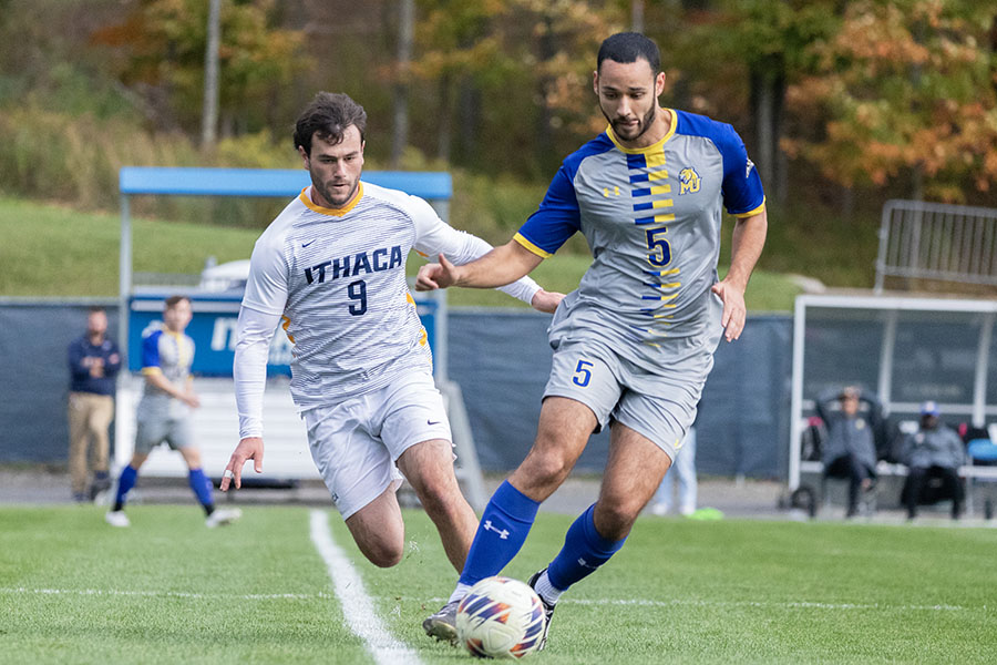 Bombers' junior forward Jared Krasnove closes in on senior defender Spencer Goldberg during the Bombers' tie to the Misericordia University Cougars. Even though the Bombers had 18 shots, they could not find the back of the net.