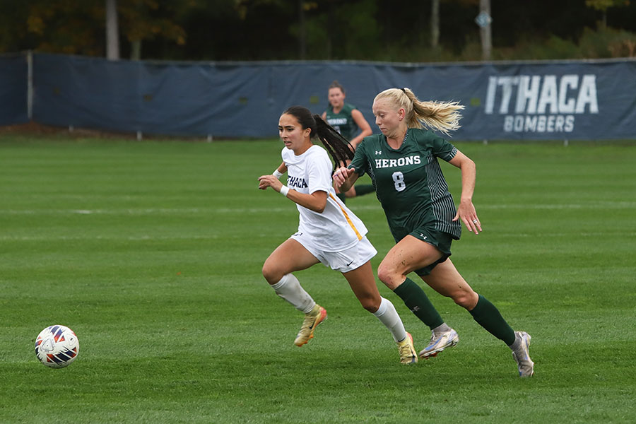 Sophomore forward Lilyana Baldi battles Herons senior defender Marjorie Plants for the ball. The Bombers secured a 1-0 victory over William Smith College with an early goal from graduate student midfielder Ally Stanton.