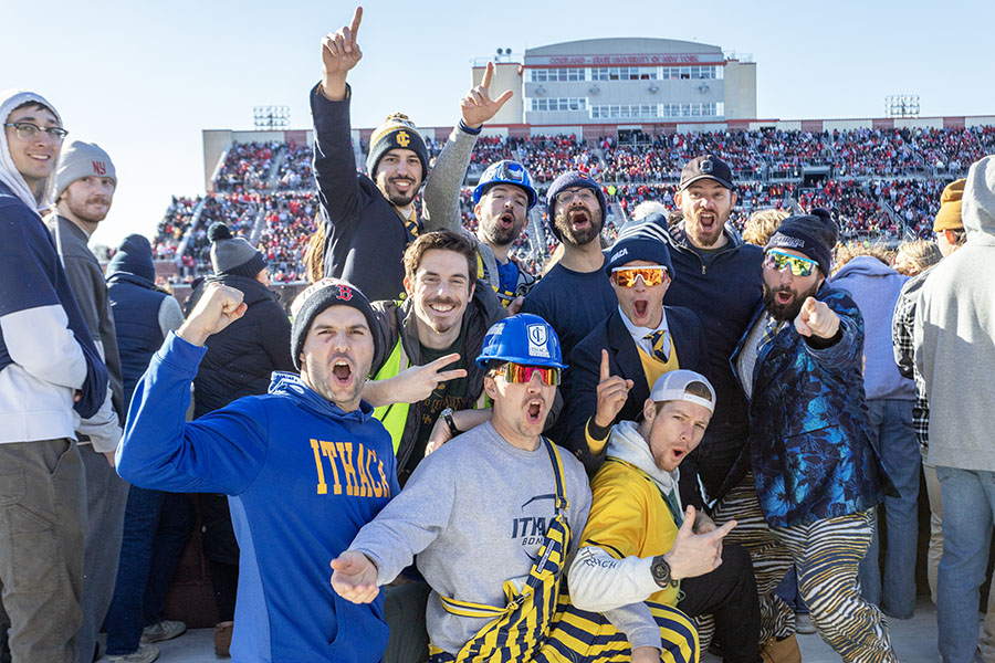 Bombers' fan pose for the photo full of energy.