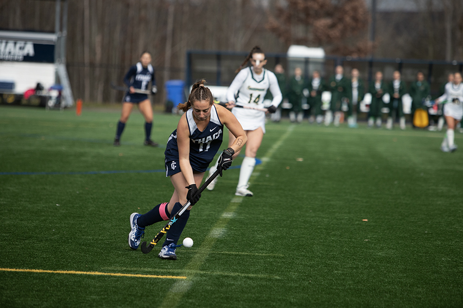 The No. 22 Ithaca College field hockey team defeated the Skidmore College Thoroughbreds to advance to the Liberty League Championship. Pictured, senior defender Madeleine Goodman plays the ball up the sideline.