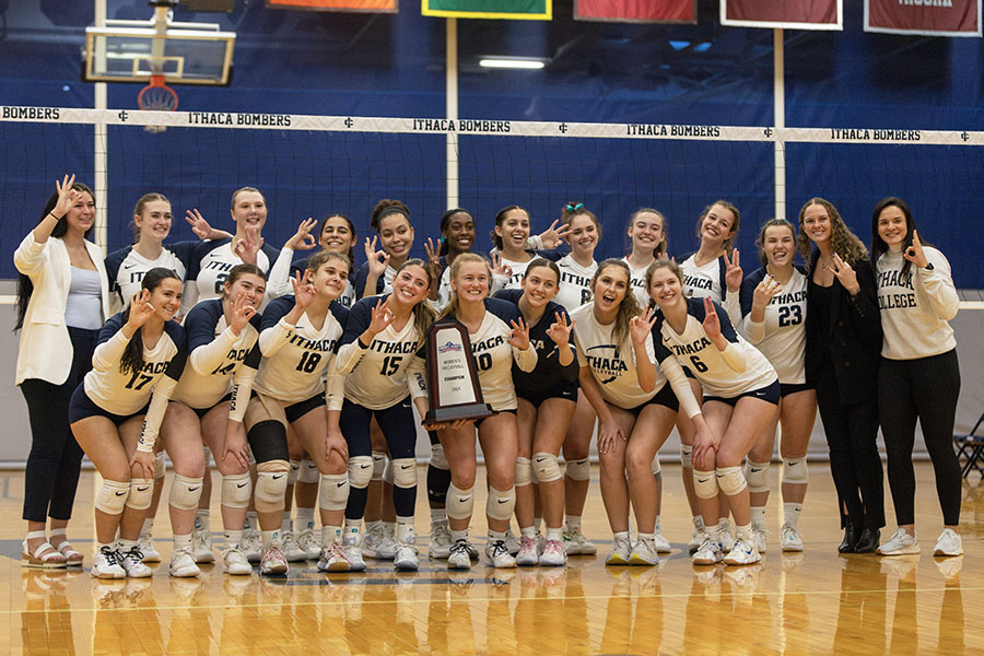 The Ithaca College volleyball team celebrates its Liberty League title victory over William Smith College. The Bombers will face Lasell University on Nov. 21 in the first round of the NCAA Tournament.