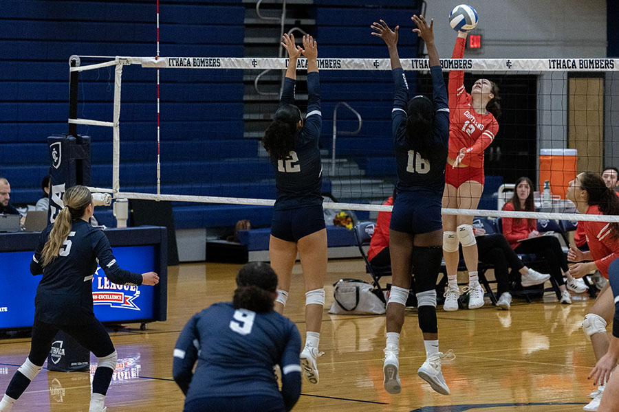 Red Dragons' senior outside hitter Jennifer Koestner goes up to spike the ball against the Bombers