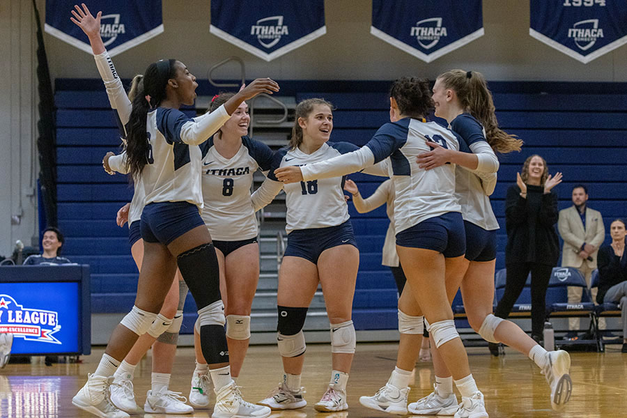 The Ithaca College volleyball team swept the Rochester Institute of Technology Tigers at Ben Light Gymnasium Nov. 1. Pictured, the team comes together to celebrate after scoring a point. 