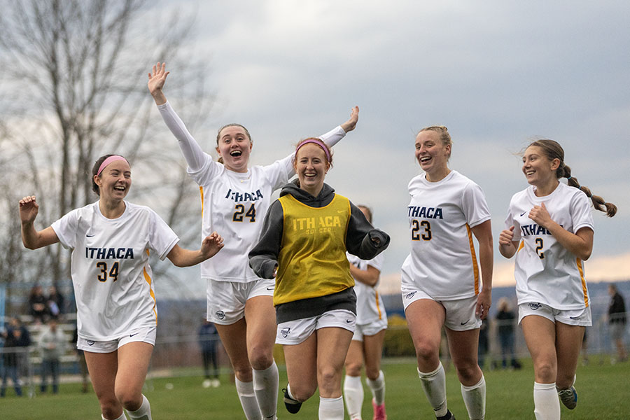 The Ithaca College women's soccer team all run happily with each other. The Bombers beat the Skidmore College Thoroughbreds 2-0 to advance to the Liberty League Championships on Nov. 8.