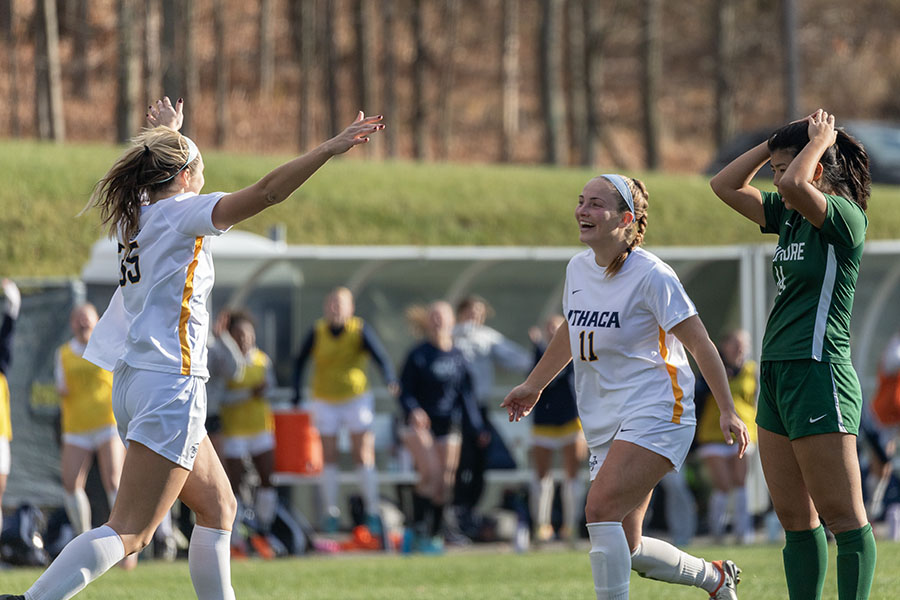 Graduate student forward Rosie Bostian and graduate student midfielder Sarah Sinott celebrate after a goal. 