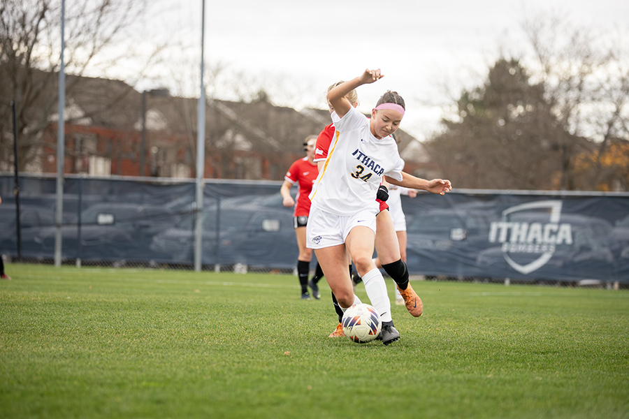 Junior defender Reese Ruegamer maneuvers the ball away from an Engineers player on the move.