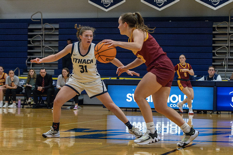 Junior guard Zoraida Icabalceta defends her opponent during the Bombers' 73–67 loss to St. John Fisher University. The Cardinals excelled at the free-throw line, converting 79% of their 34 attempts.