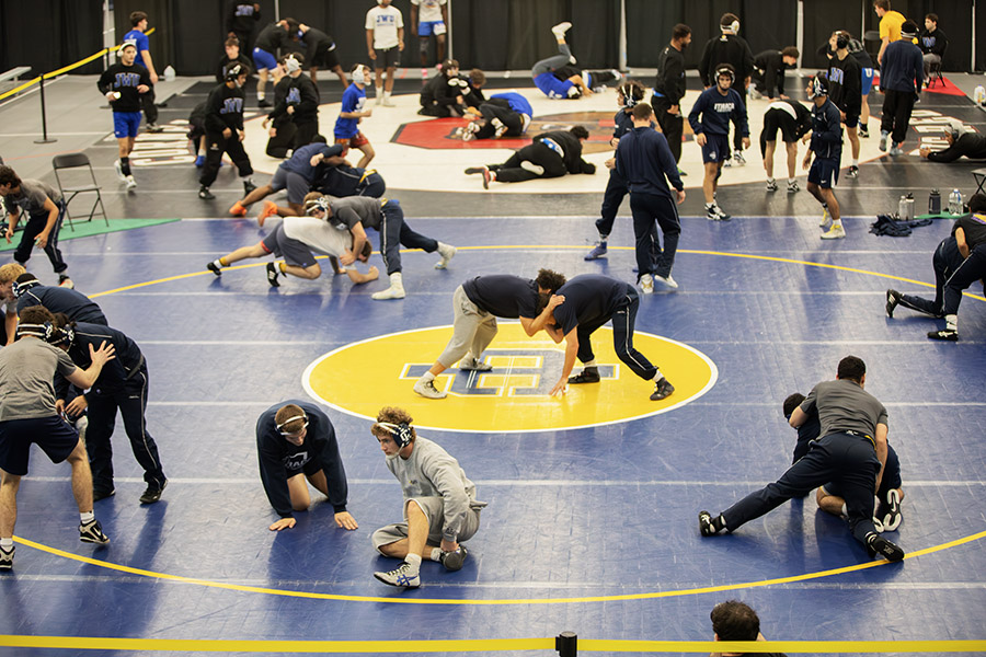 The Ithaca College wrestling team hosted its annual Bomber Invitational Nov. 1-2 to kick off the 2024-25 season. Pictured, the team warms up before competition begins.