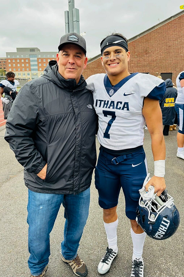 Father Scott (left) and son Jake (right) come together after a football game at the University of Rochester.