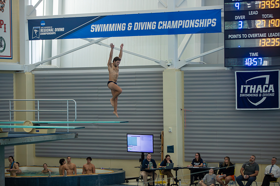 The Ithaca College swimming and diving teams defeated the Gannon University Golden Knights on its senior day. Pictured, senior diver Samuel Smith jumps up for his dive.