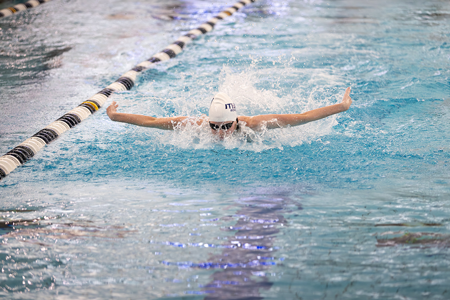 Sophomore swimmer Kathleen Papiernik competes with her team in a 200-yard medley relay against the Gannon University Golden Knights on the Bombers' senior day Jan. 25.