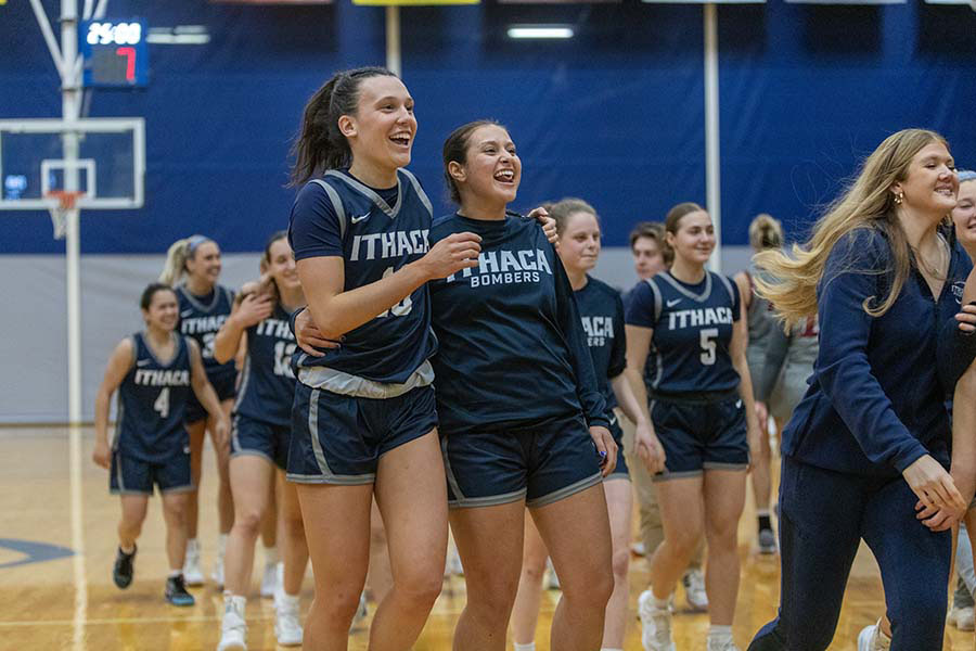 The Ithaca College women's basketball team celebrates after its early season win over the Vassar College Brewers Dec. 6.