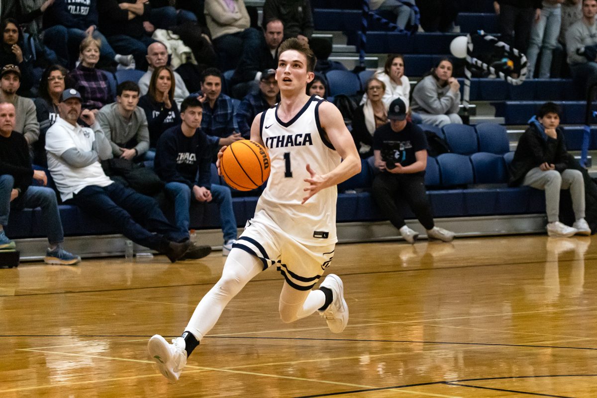 The Ithaca College men's basketball team fell short of a miraculous comeback to the Rensselaer Polytechnic Institute Engineers Feb. 8. Pictured, senior guard Logan Wendell drives up the open court to the paint.