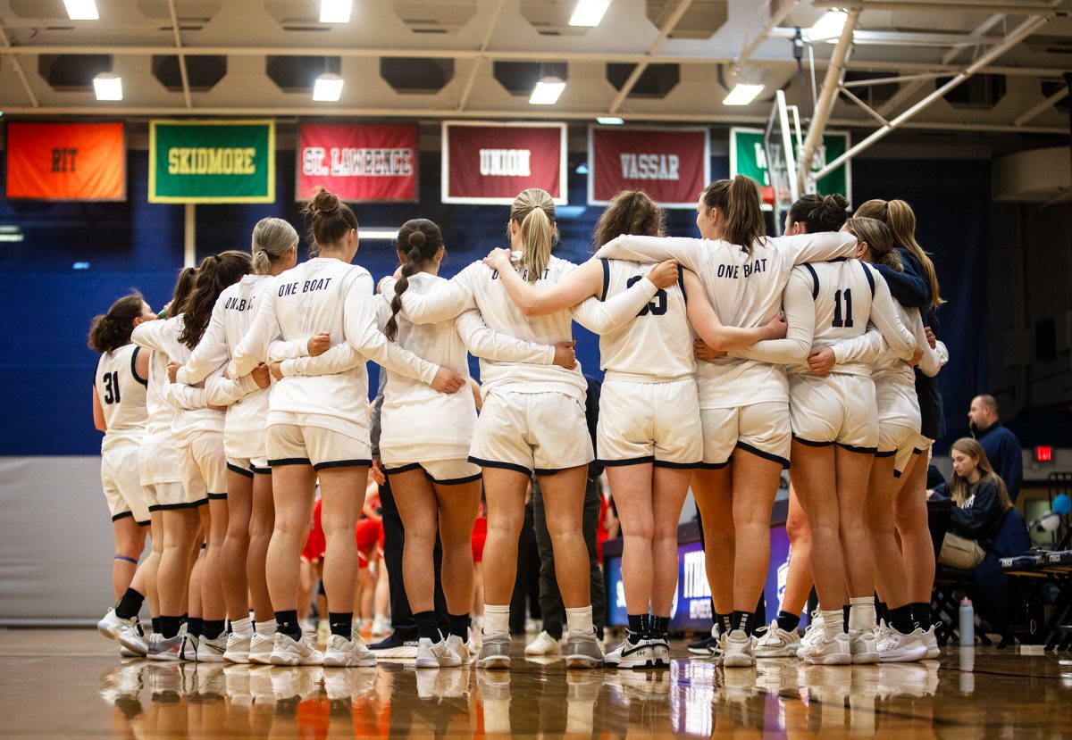 The team huddles up during their Feb. 8 senior day victory against Rensselaer Polytechnic Institute. This was the squad's tenth consecutive victory and they are riding a 13-game win streak with only two regular season games remaining, as of Feb. 19