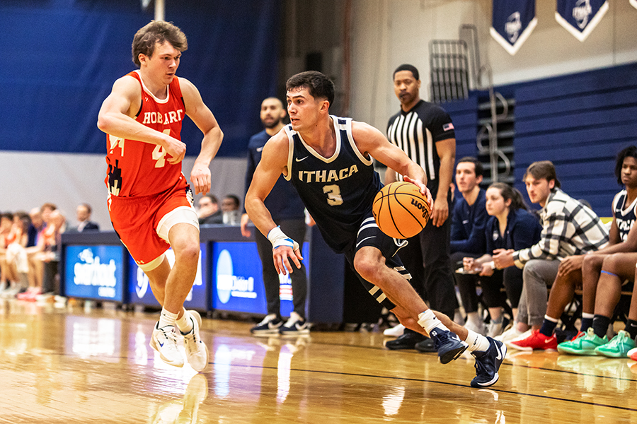 The Ithaca College men's basketball team defeated the Hobart College Statesmen at Ben Light Gymnasium Jan. 31. Pictured, senior guard Aidan Holmes pushes past the defender to reach the basket.