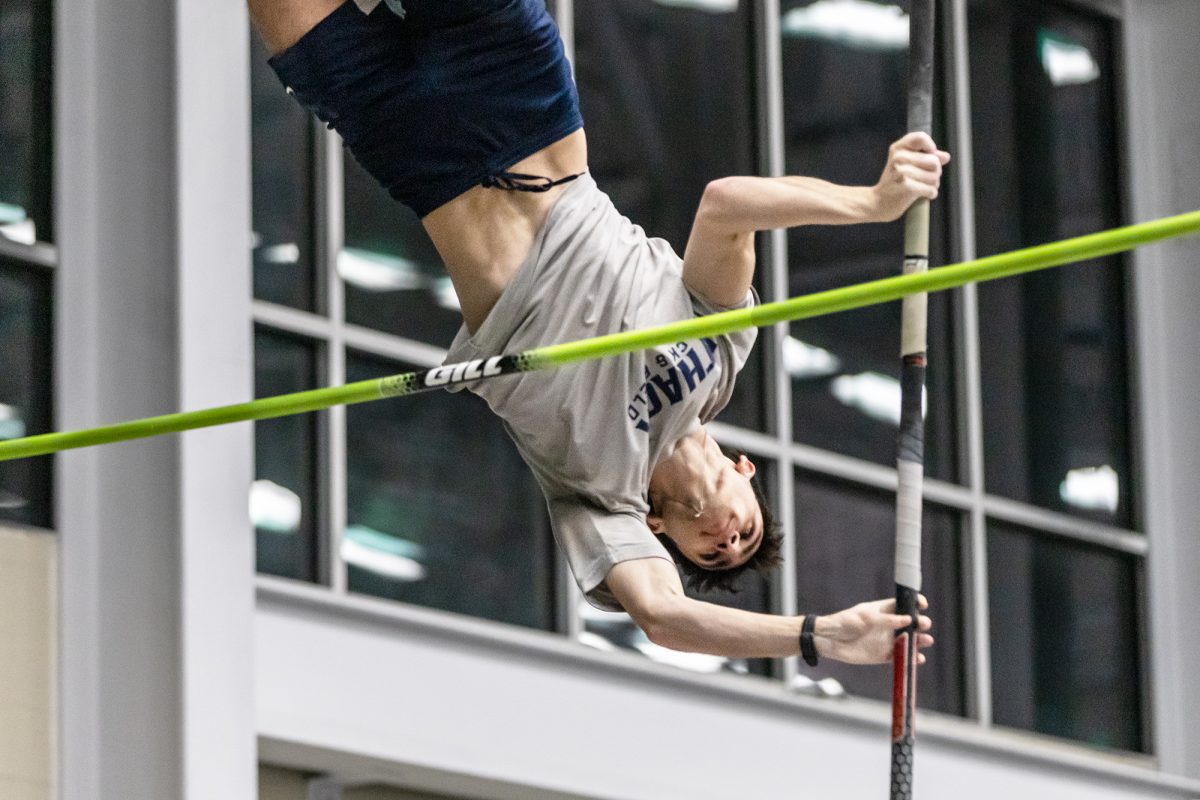 Senior pole vaulter Shaun Herlihy clears a bar at practice at the Athletics & Events Center. The team captain is hoping to return to his old form, while continuing to lead the team as he has from off the track 