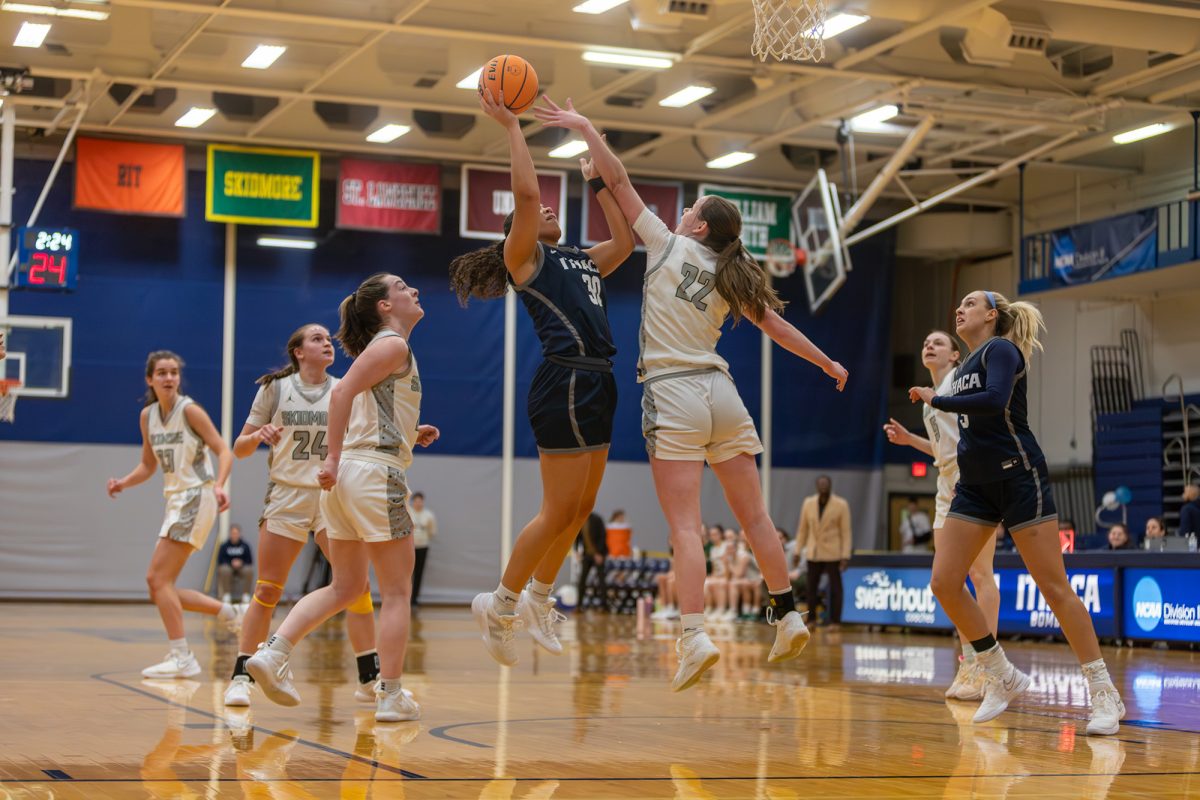 The Ithaca College women's basketball team took care of business against the Skidmore College Thoroughbreds Feb. 7. Pictured, senior forward Anya Watkins jumps up and takes a contested shot.