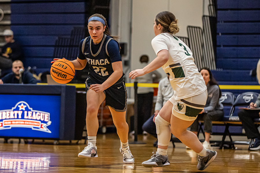 First-year guard Natalie Tucker drives toward the basket against a William Smith defender.