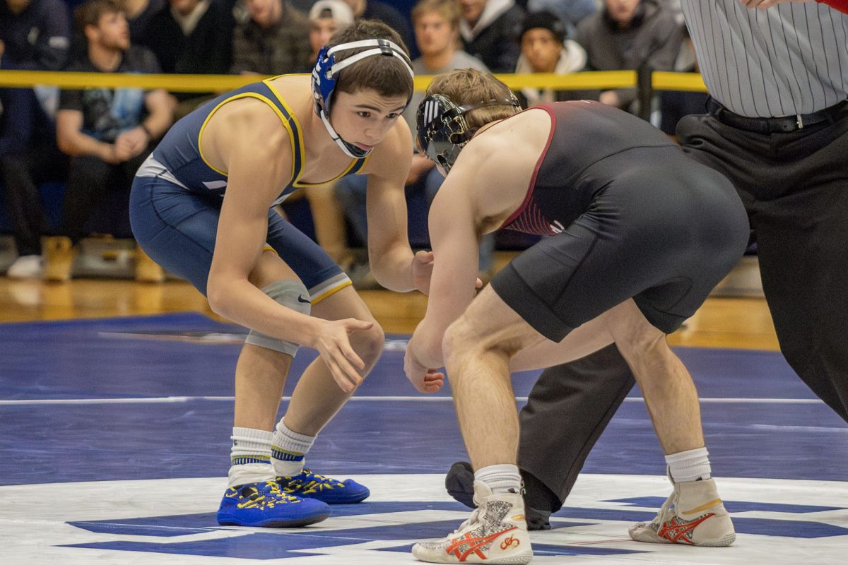 Ithaca first-year student Tomah Gummow gets his squad going with a victory in the 125 pound bout.