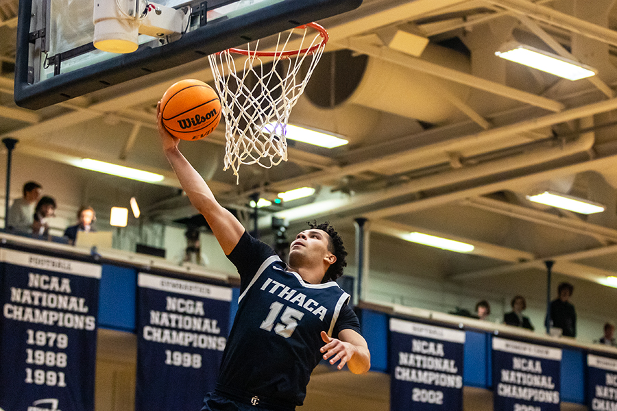 Sophomore guard Evan Cabral leaps up for the dunk for the Bombers.