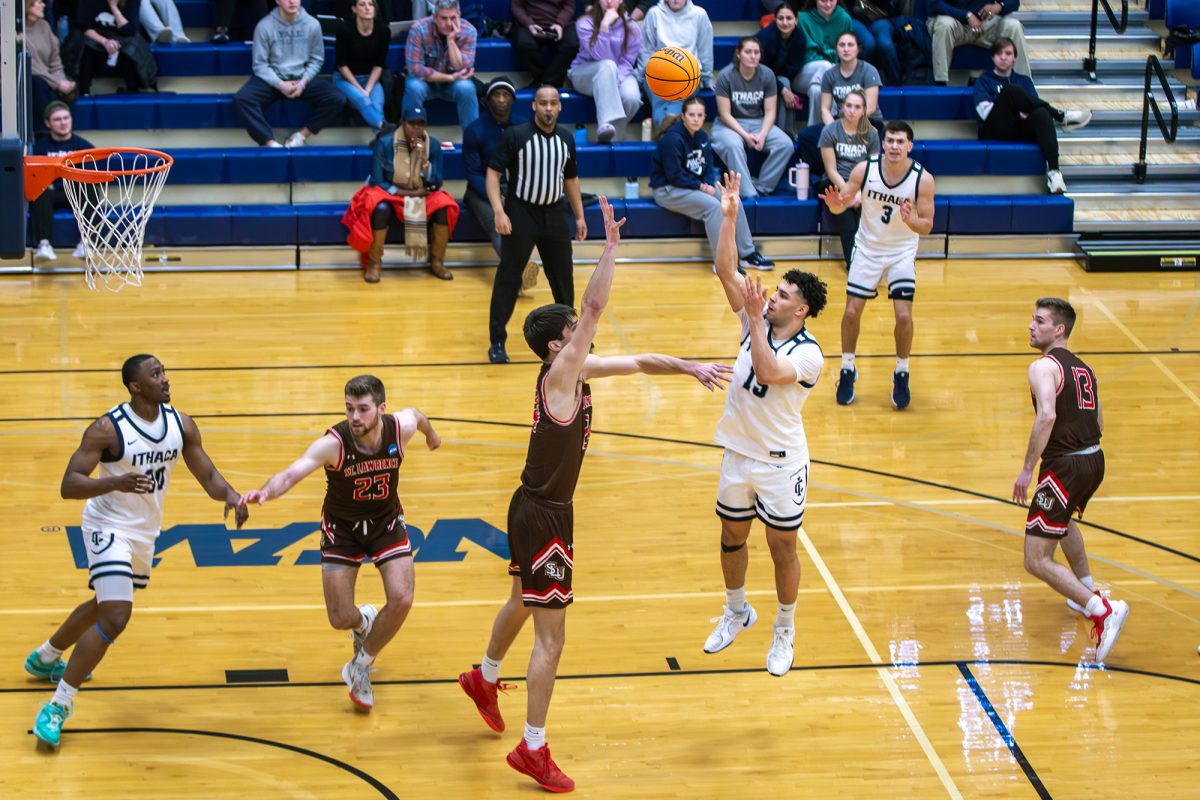 Sophomore guard Evan Cabral pulls up from just inside the free throw line.