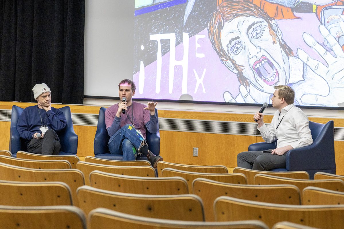 Tynan DeLong (left) and Corey Hughes (middle) talk about their respective short films with Andrew Vielkind (right). Their work explored themes of escapism.