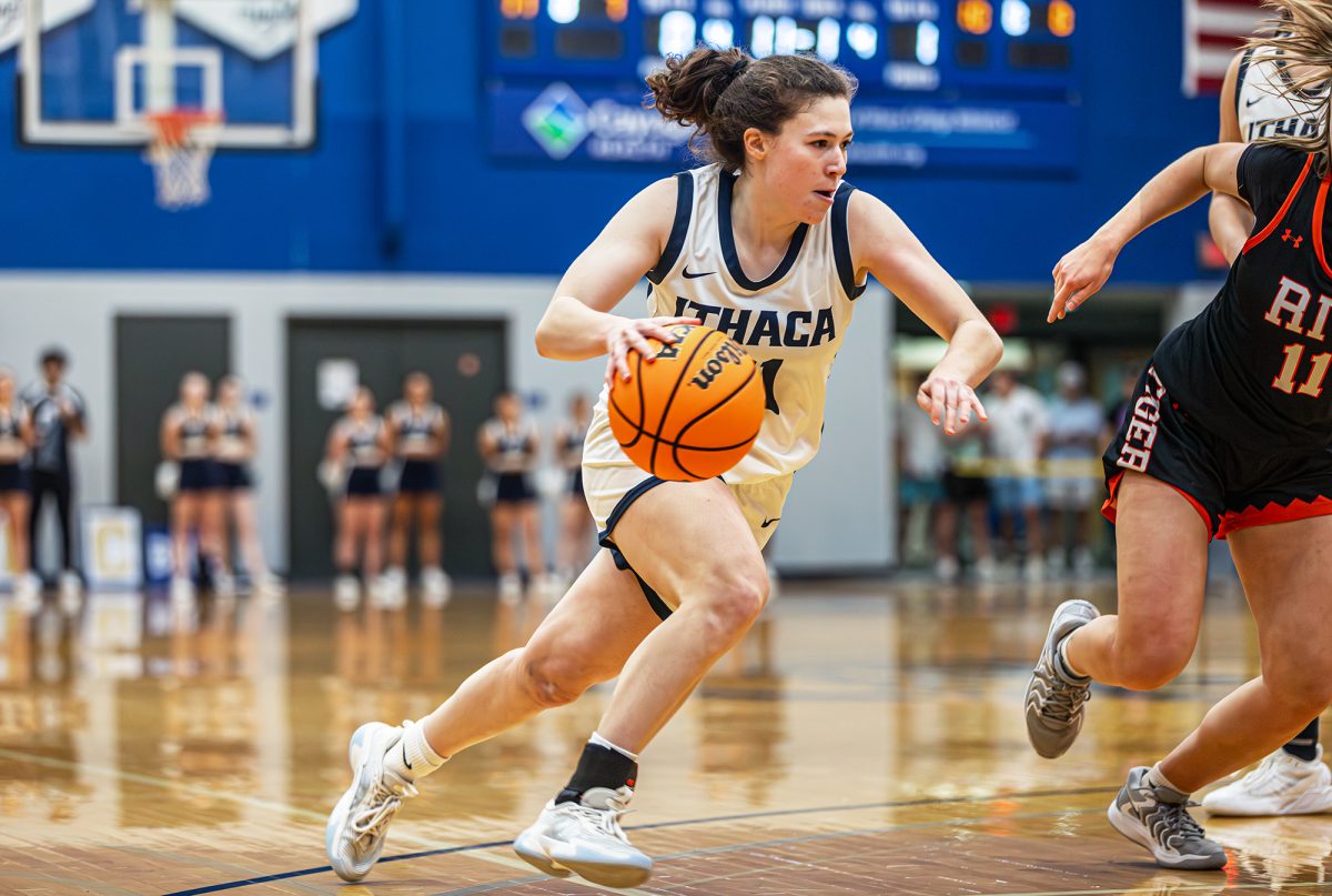 The Ithaca College women's basketball team advanced to the Liberty League Championship with a win over the Rochester Institute of Technology Tigers Feb. 28. Junior guard Zoraida Icabalceta drives the ball to the basket.