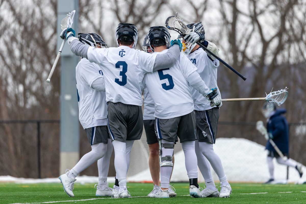 The Ithaca College men's lacrosse team won its second consecutive game at Higgins Stadium March 1. The team comes together after scoring a goal.