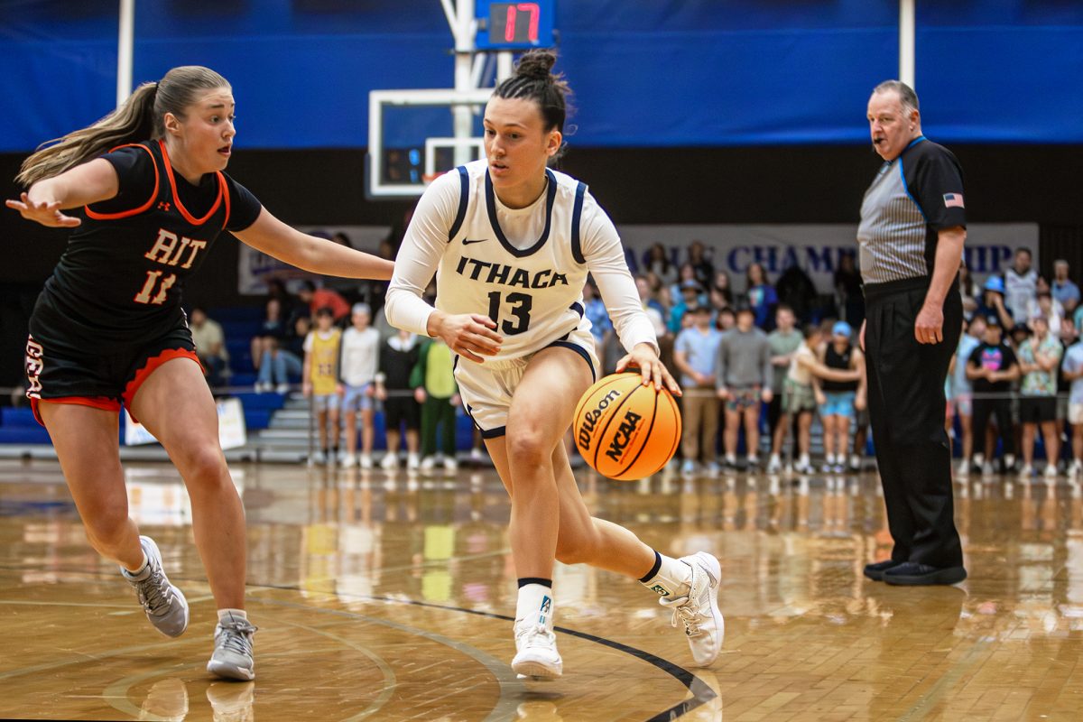 Graduate student guard June Dickson pushes against a Tigers' defender toward the basket.