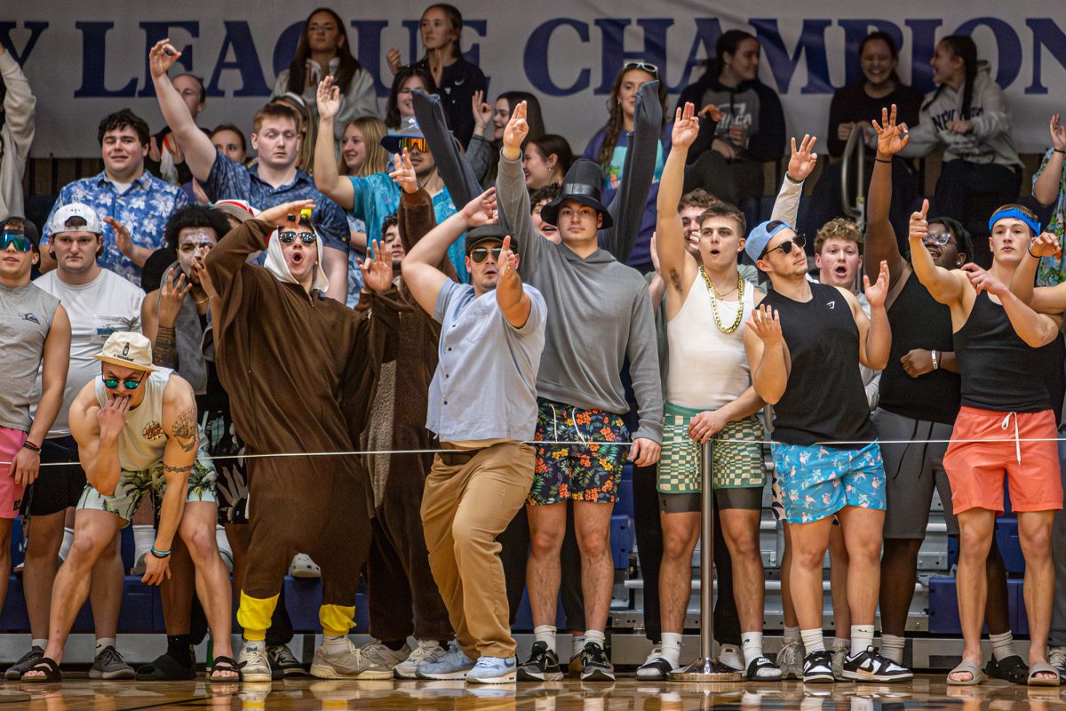 The students in the stands fire up the Bombers as they take on the Saints.