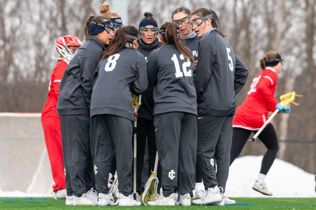 The Ithaca College women's lacrosse team defeated the SUNY Cortland Red Dragons at Higgins Stadium March 1. The team huddles before resuming play.