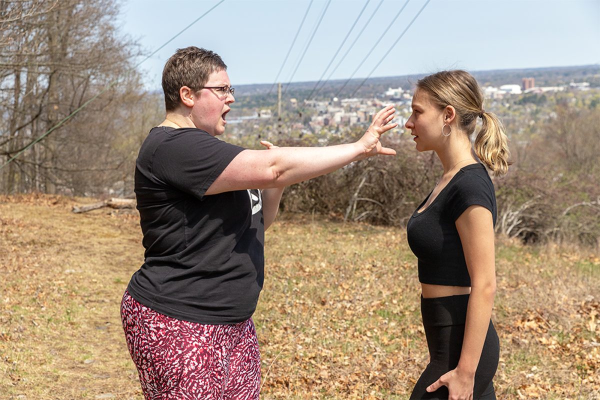 From left, Wen-Do self-defense instructor Kristi Taylor demonstrates a move called eagle claw on reporter Haley Meberg. This technique utilizes the pads of your fingers to claw an attacker's eyes.