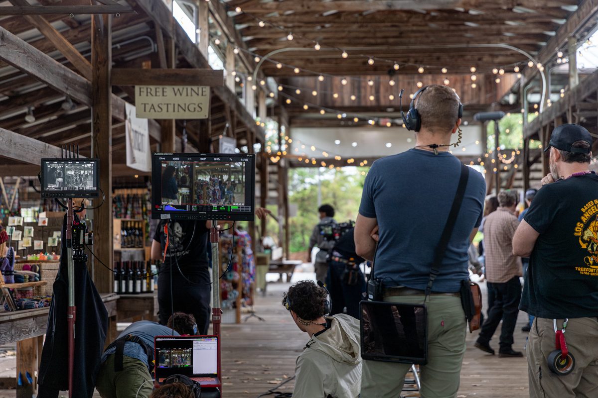 The Ithacan was invited to observe a behind the scenes shooting for “In Fading Twilight” at Ithaca Farmers Market Aug. 20. At the film set, student production assistants stayed busy by taking and giving directions into their walkies and aiding in the scene setting process. 