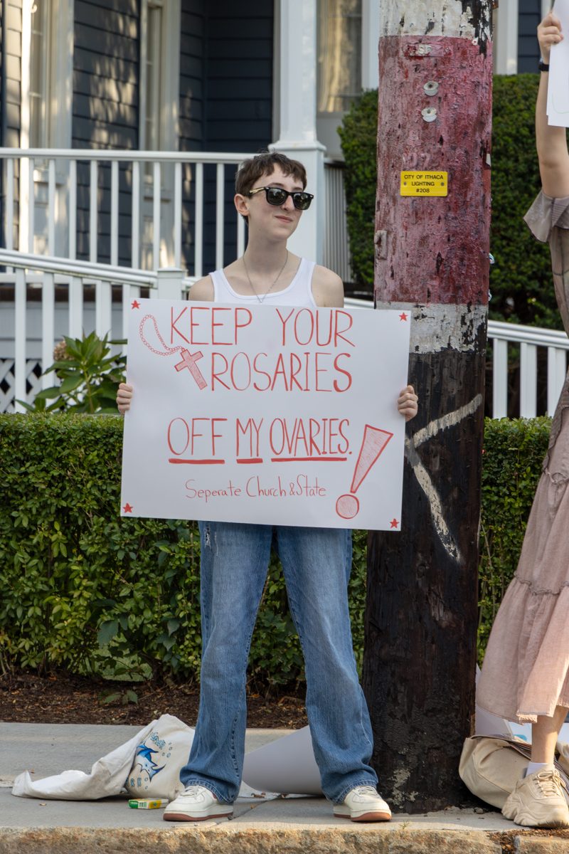 Sophomore Mikaela Sadik held a sign to protest crisis pregnancy centers, which are technically nonmedical facilities, so the staff are not legally subject to the Health Insurance Portability and Accountability Act (HIPAA) or client confidentiality laws.