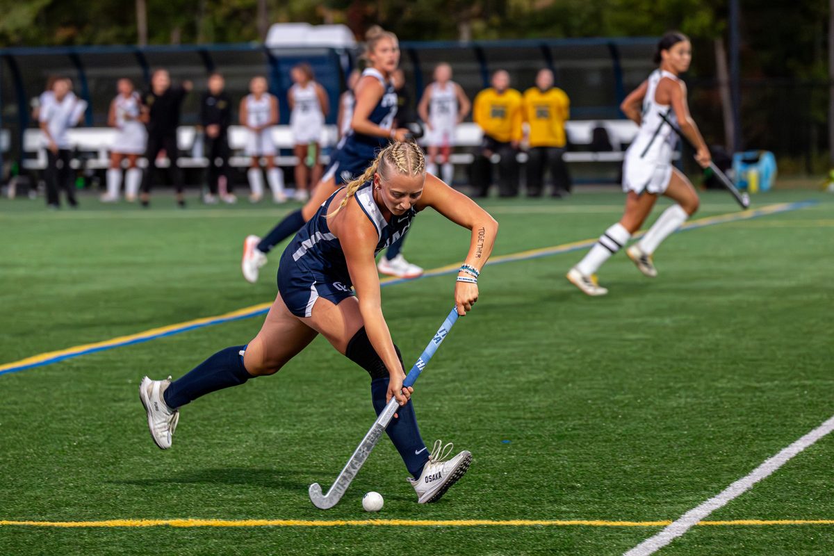 Bombers' junior midfield Payton Yahner rushes down the field with the ball in the Bombers' 9-0 victory over the Golden Eagles on Sept. 17.