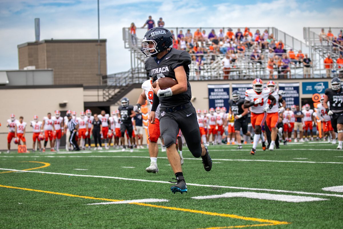Junior quarterback Matthew Parker runs down the field during the Bombers' Sept. 27 nail-biter against the Hobart College Statesmen.