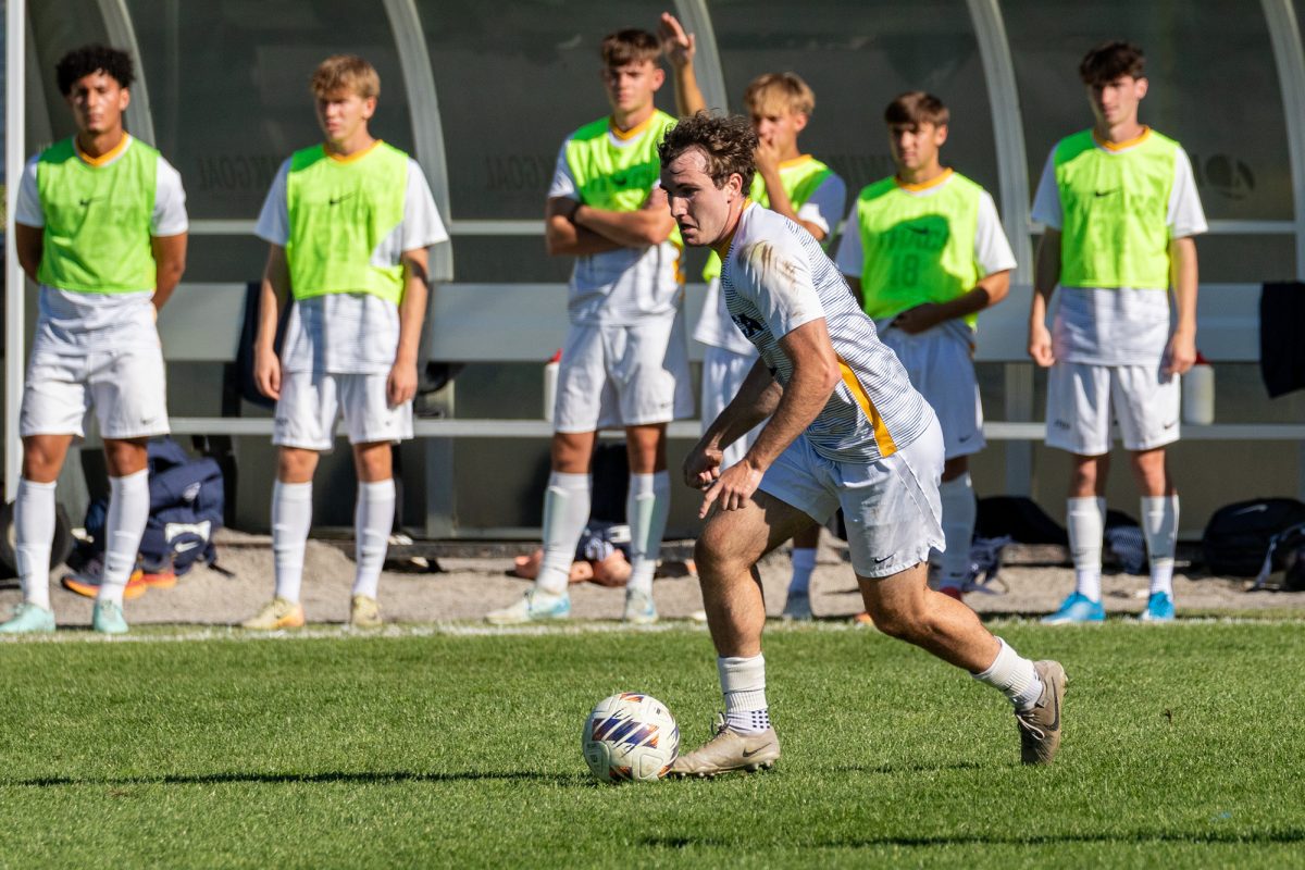 Senior forward Nathan Waychoff brings the ball down the field in a 1-0 win over Hobart College.