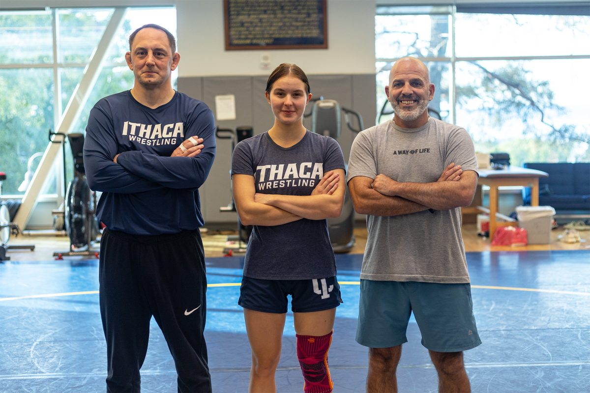 From left, head coach Ryan Ciotoli '02 and assistant coaches Kate Zavuholnik and Joel Ferrara will lead the women's wrestling team in its inaugural season when the team takes to the mat this winter.