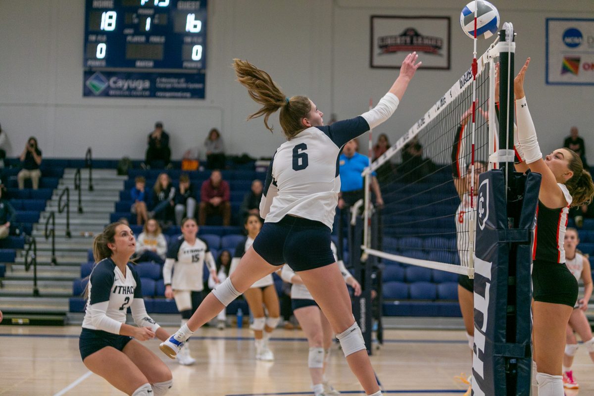 Sophomore Brianna Owen tips the ball over the net in a doubleheader sweep against the William Smith College Herons and the William Paterson University Pioneers on Oct. 25.