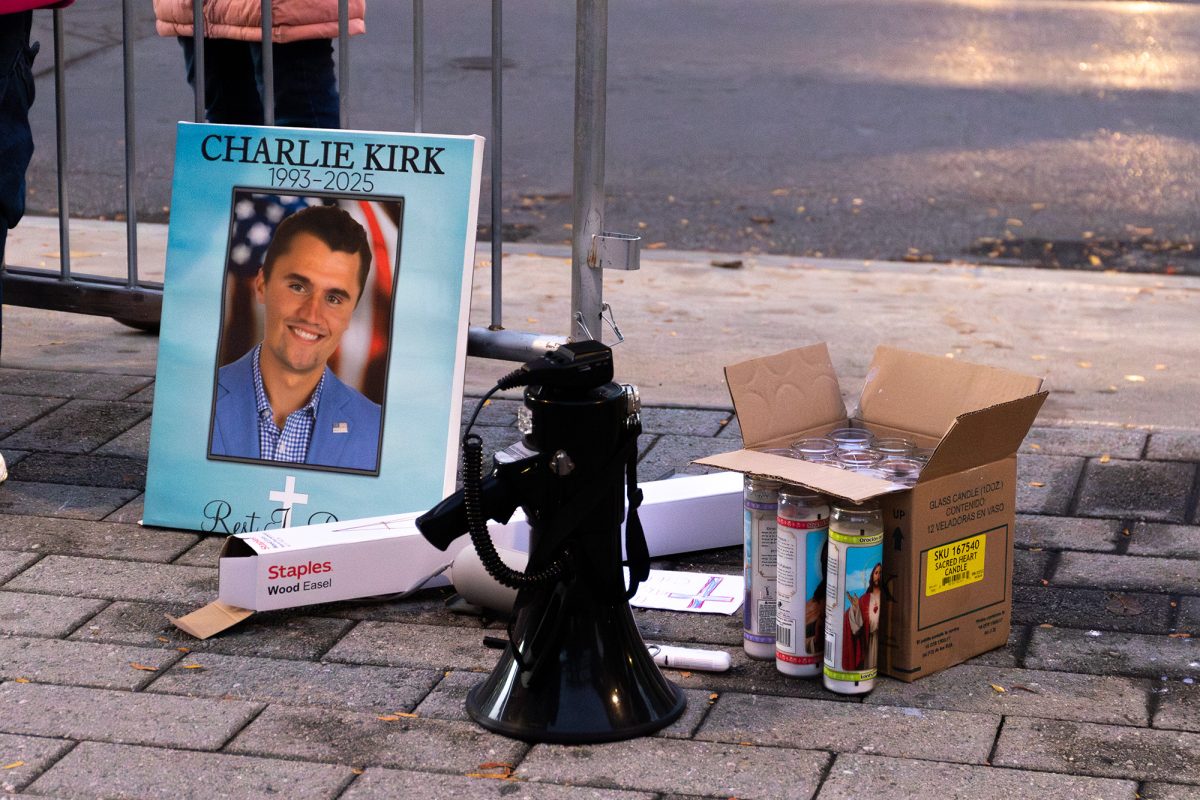 About 15 residents of the greater Ithaca area held a vigil in remembrance of Charlie Kirk on the evening of Oct. 14 at the Bernie Milton Pavilion on The Commons.