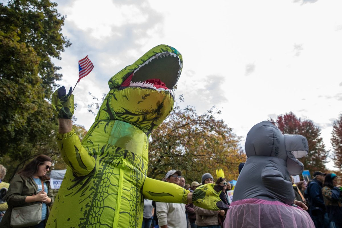 Protester wearing inflatable dinosaur as part of "Operation Inflation," which started in Portland, Oregon in an effort to spread joy and nonviolence messages at protests. 