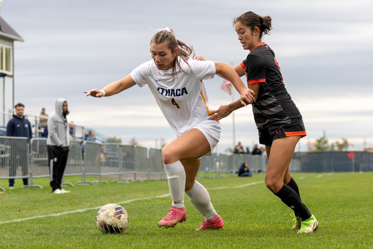 Senior forward Ava Detorie dribbles past a RIT senior defender Roberta Moger in a 1-0 loss on Oct. 21.