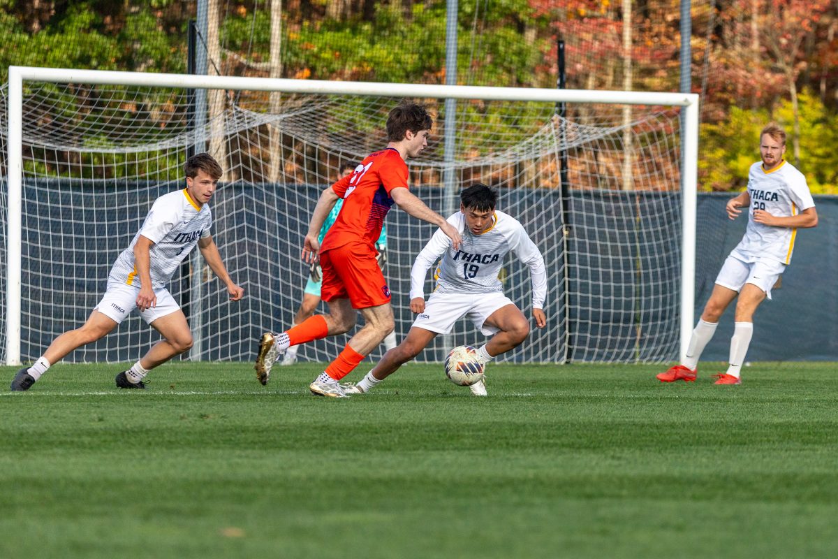 From left, midfielders senior Drew Warren, sophomore Emmett Enriquez and graduate student Ikey Borden block Hobart first-year midfielder Gabe Smith in front of the goal in a tight 3-2 loss on Oct. 8.