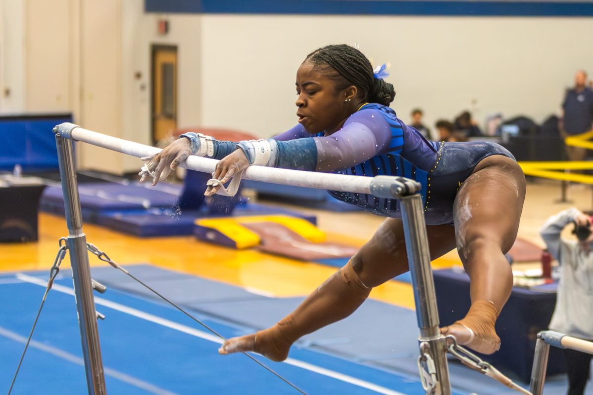 First-year all-around Sh'Nai Thompson performs her routine on bars in the 189.950-188.475 win against Ursinus College