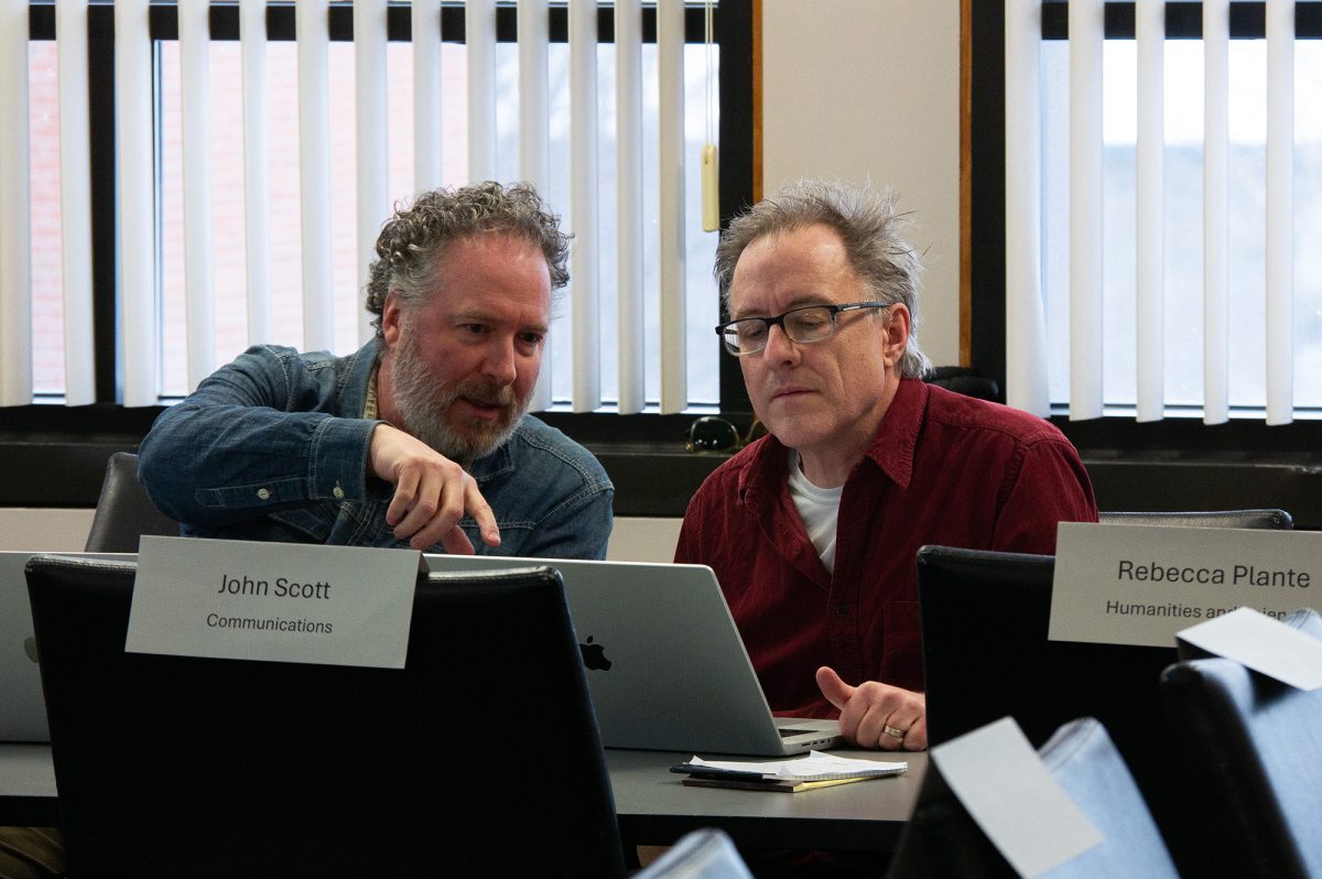 From left, Devan Rosen, professor in the Department of Media Arts, Sciences and Studies, and John Scott, professor in the Department of Media Arts, Sciences, and Studies and documentary studies program director, heard from the Provost at the Feb. 3 Faculty Council meeting.
