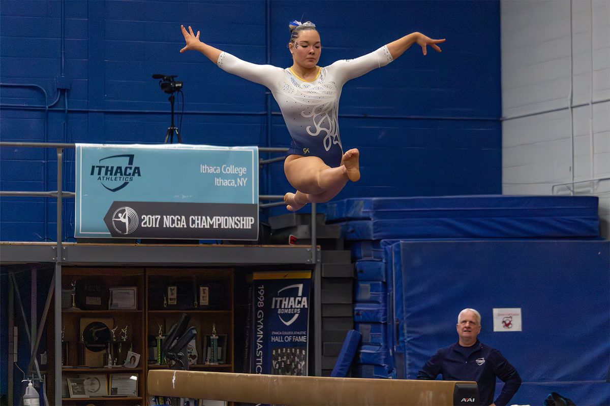 First-year gymnast Leanne Desjardins executes in a leap on the balance beam. Desjardins scored a solid 9.700, contributing to the 47.950 total on the beam.